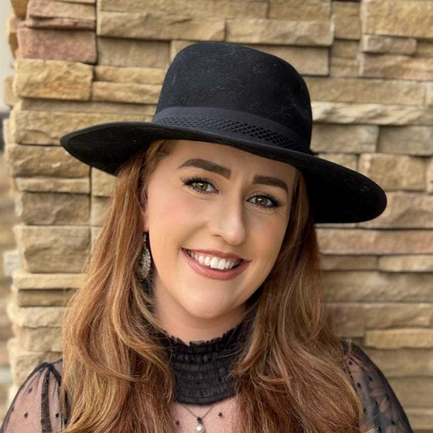 Portrait of Maddy Feliciano, a professional stylist at Soho Salon, showcasing their expertise and style.